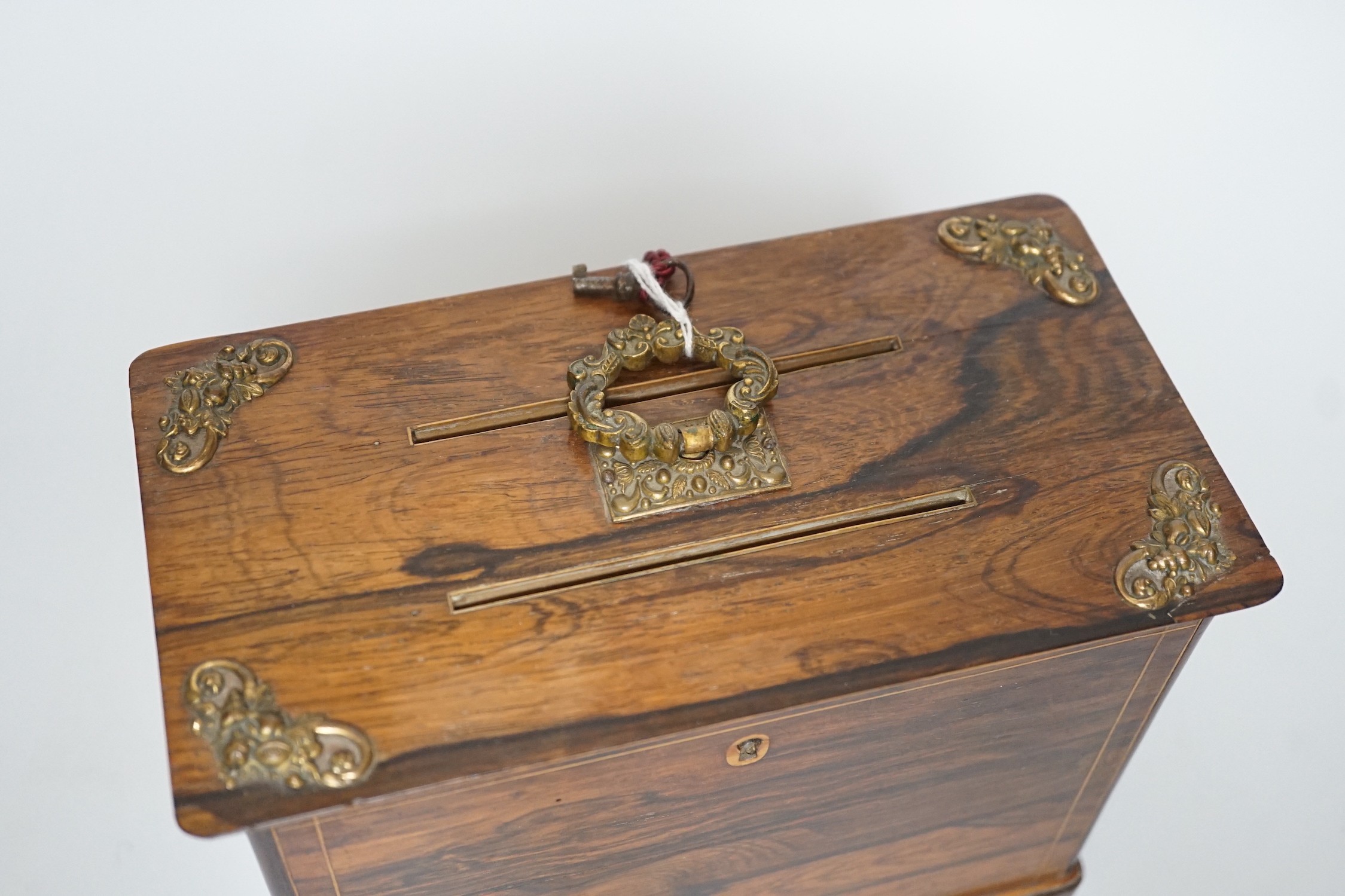 A late 19th century French rosewood letter box, with brass mounts, handle and key, 15.5cms high x 19.5cms wide